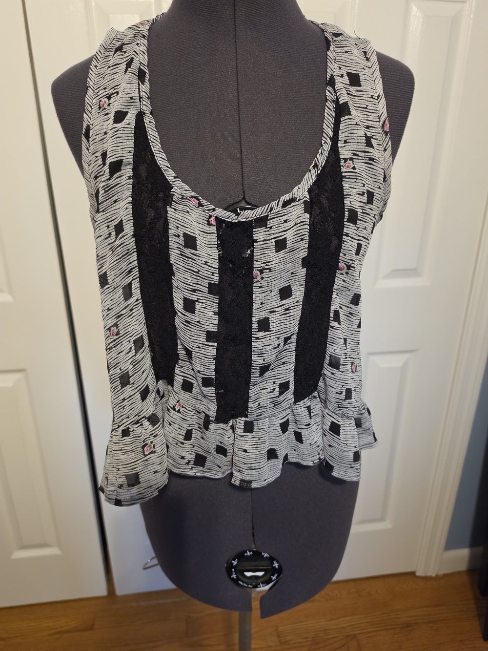 Sleeveless Black & White Peplum Tank with Lace Insets